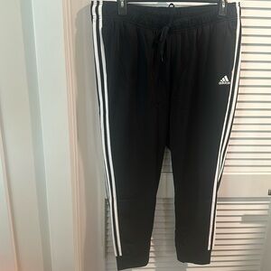 NWT Adidas Slim Fit Straight Leg joggers in black with white stripes on sides.